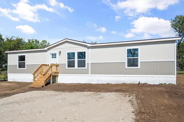 a front view of a house with a outdoor space
