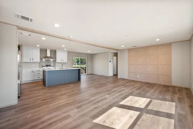 a view of kitchen cabinet and microwave