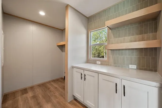 a kitchen with a sink and cabinets