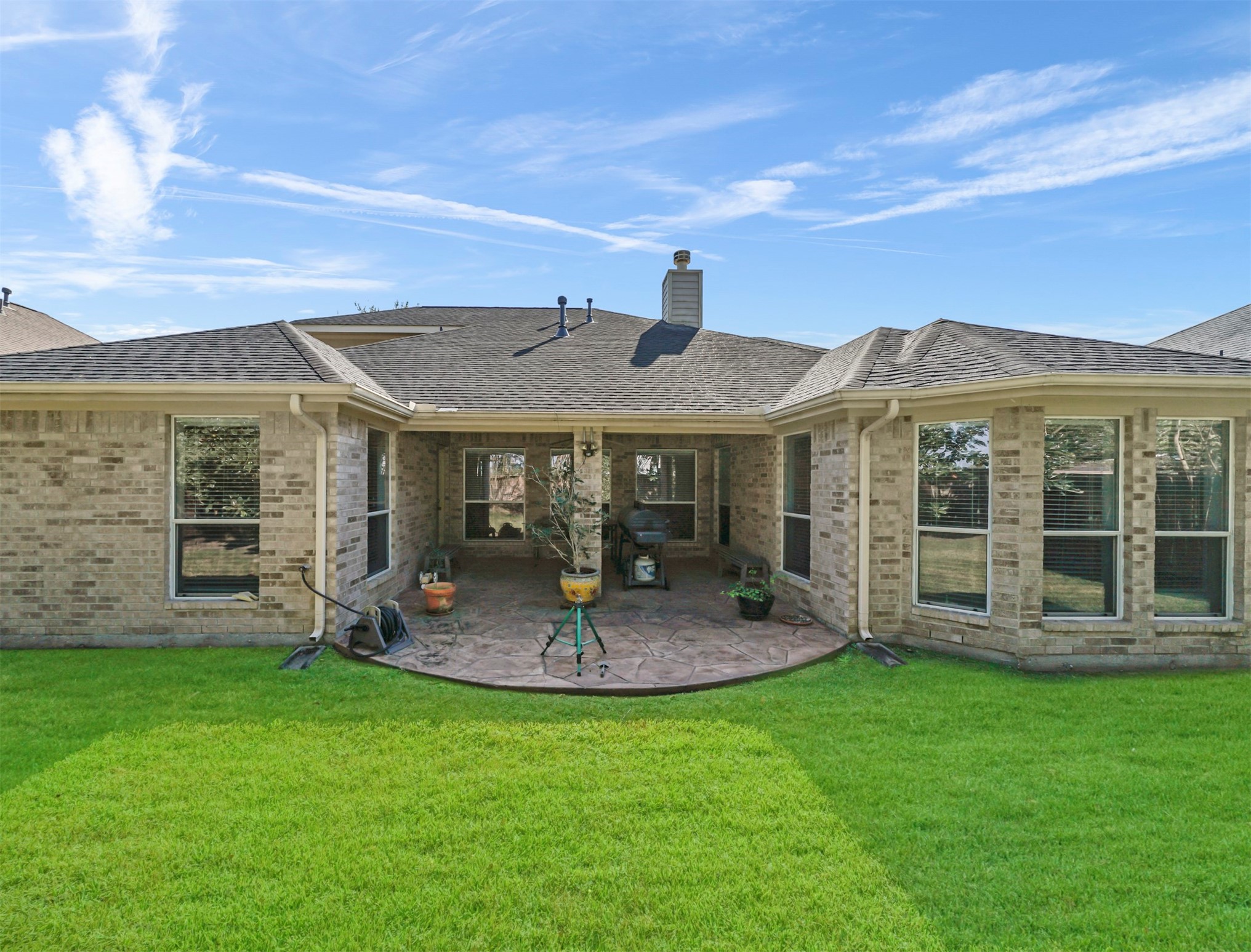 8214 Garrison Point Drive Houston, TX 77040 - Photo 30 of 37 a view of a house with a backyard and porch