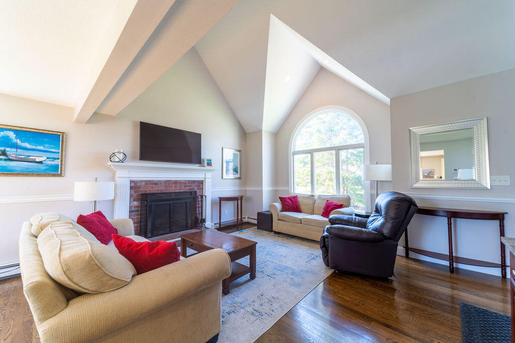 18 Windsor Road Sandwich, MA 02563 - Photo 12 of 35 a living room with furniture fireplace and window