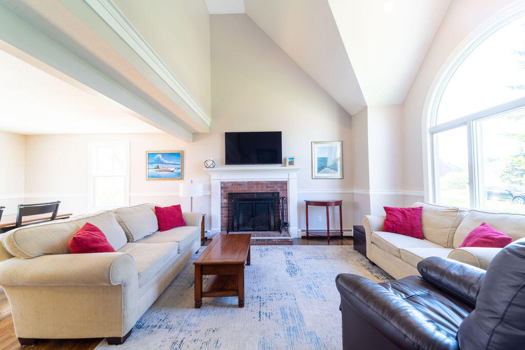 18 Windsor Road Sandwich, MA 02563 - Photo 13 of 35 a living room with furniture fireplace and window
