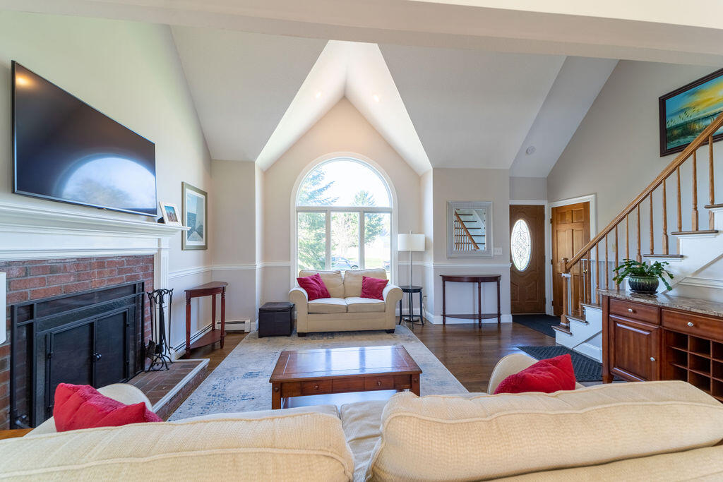 18 Windsor Road Sandwich, MA 02563 - Photo 16 of 35 a living room with furniture fireplace and flat screen tv