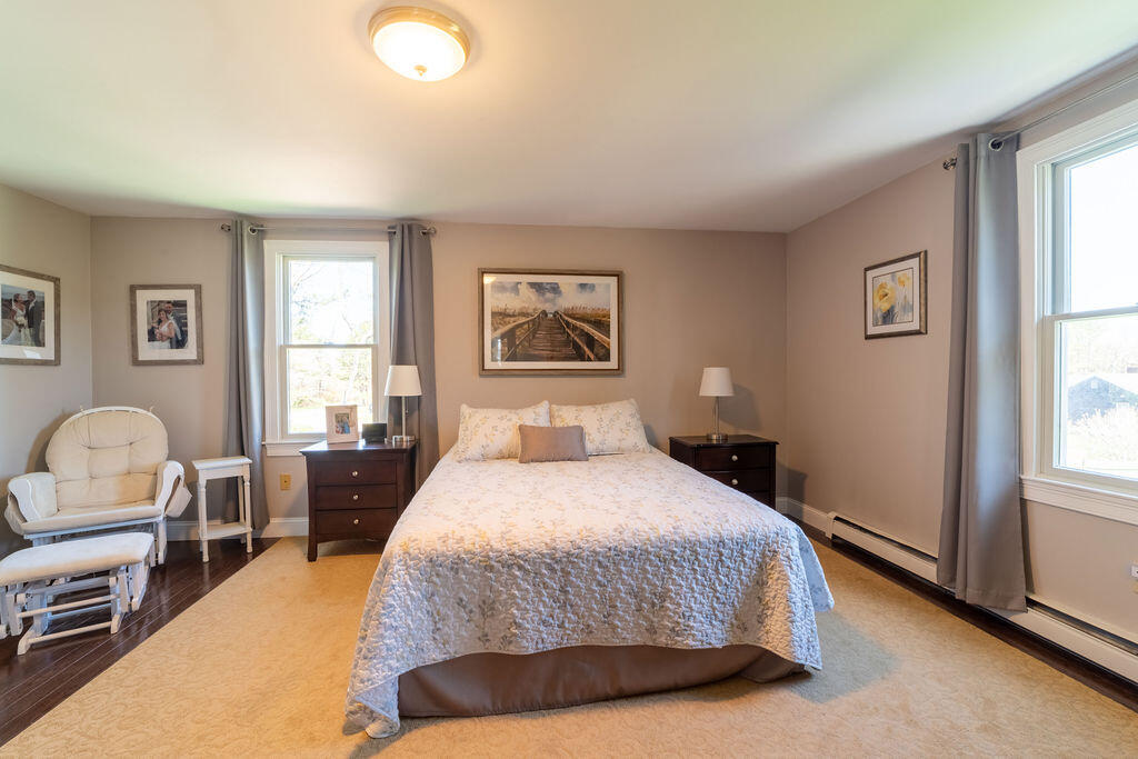 18 Windsor Road Sandwich, MA 02563 - Photo 19 of 35 a bedroom with bed and a window