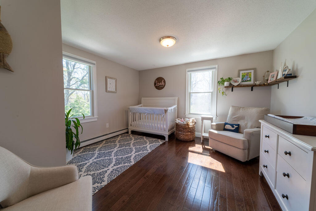 18 Windsor Road Sandwich, MA 02563 - Photo 21 of 35 a living room with furniture and a window