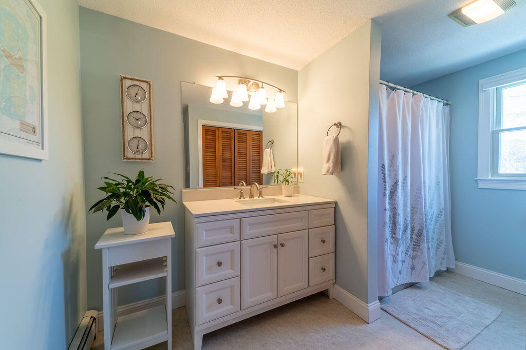 18 Windsor Road Sandwich, MA 02563 - Photo 25 of 35 a bathroom with a sink vanity and a mirror
