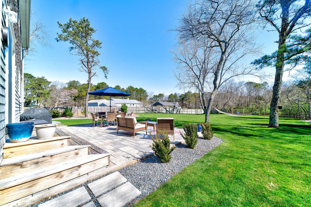 18 Windsor Road Sandwich, MA 02563 - Photo 29 of 35 a view of a backyard with sitting area