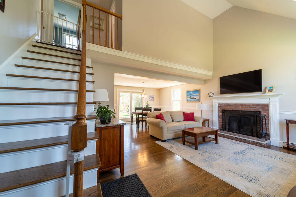 18 Windsor Road Sandwich, MA 02563 - Photo 3 of 35 a living room with furniture fireplace and rug