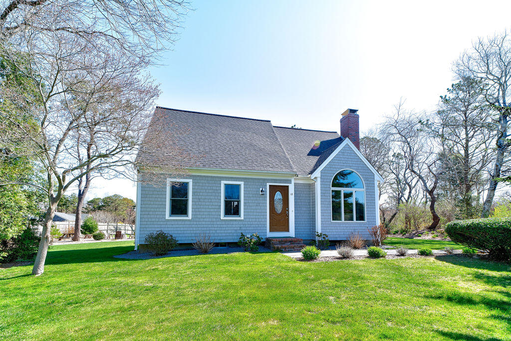 18 Windsor Road Sandwich, MA 02563 - Photo 5 of 35 a front view of a house with a garden