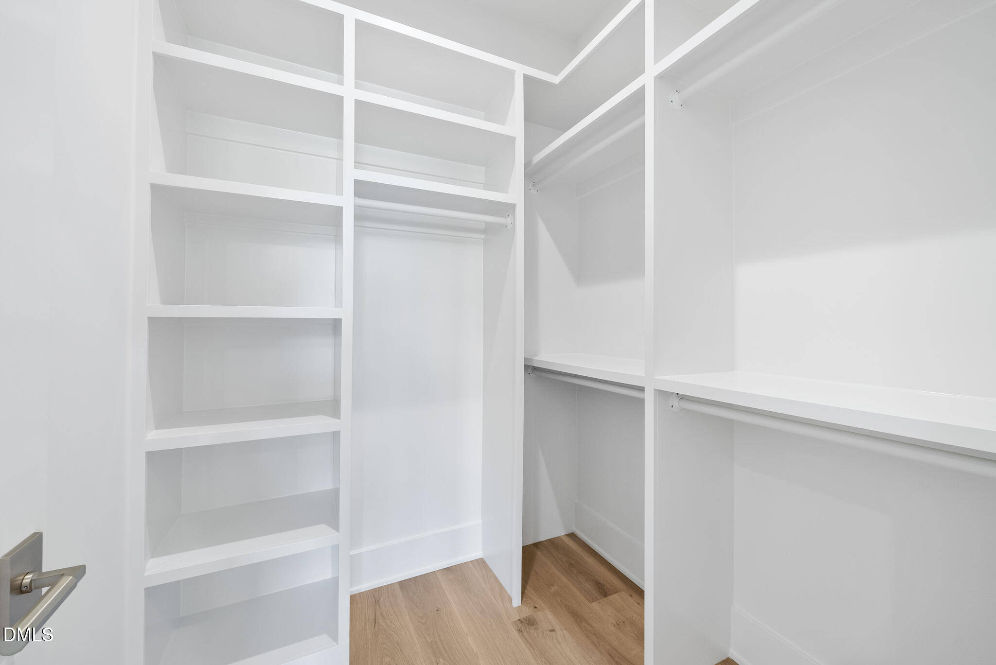 7608 Falls Creek Lane Raleigh, NC 27614 - Photo 64 of 74 a view of walk in closet with empty racks