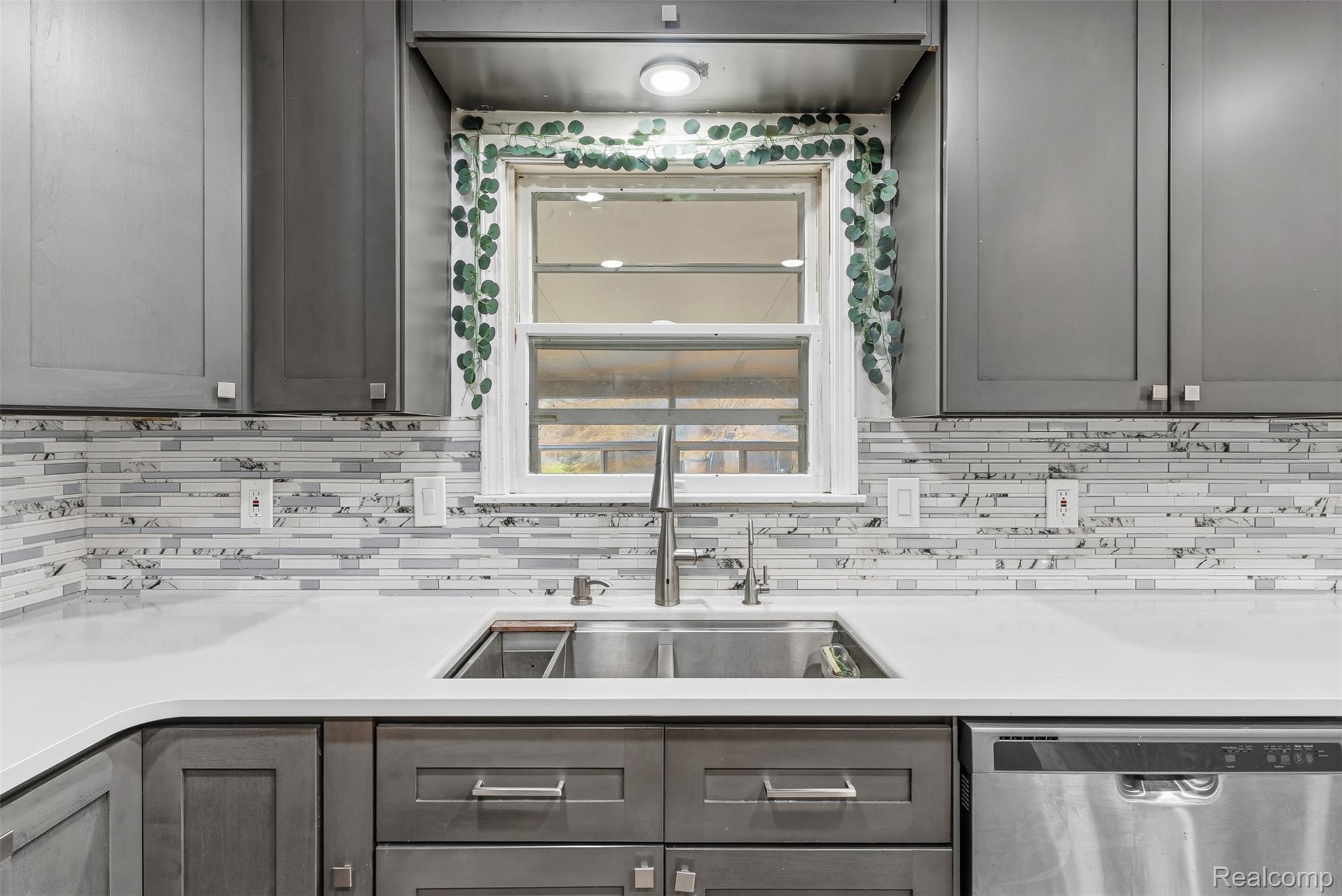 3432 South State Road Davison, MI 48423 - Photo 28 of 58 Kitchen featuring stainless steel dishwasher and a sink