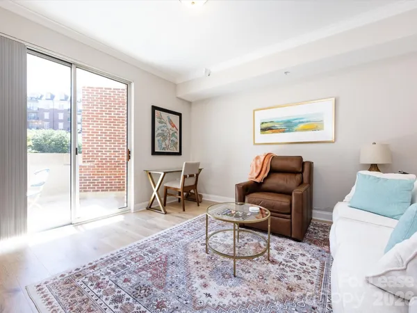 a living room with furniture and a gate