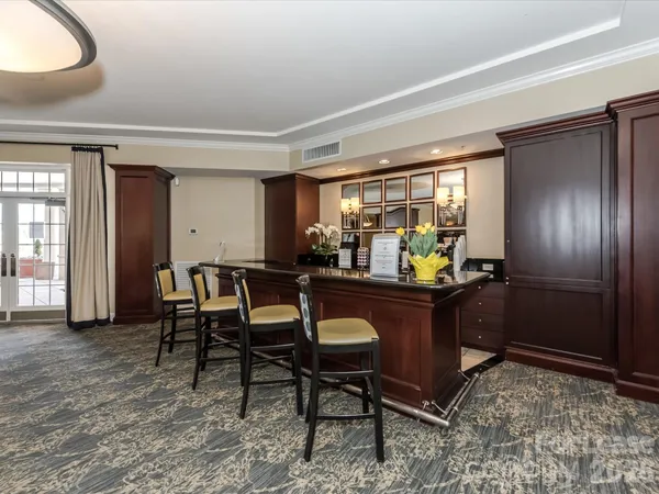 a room with a wooden table and chairs