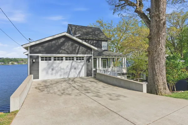a living room with fireplace furniture and a flat screen tv