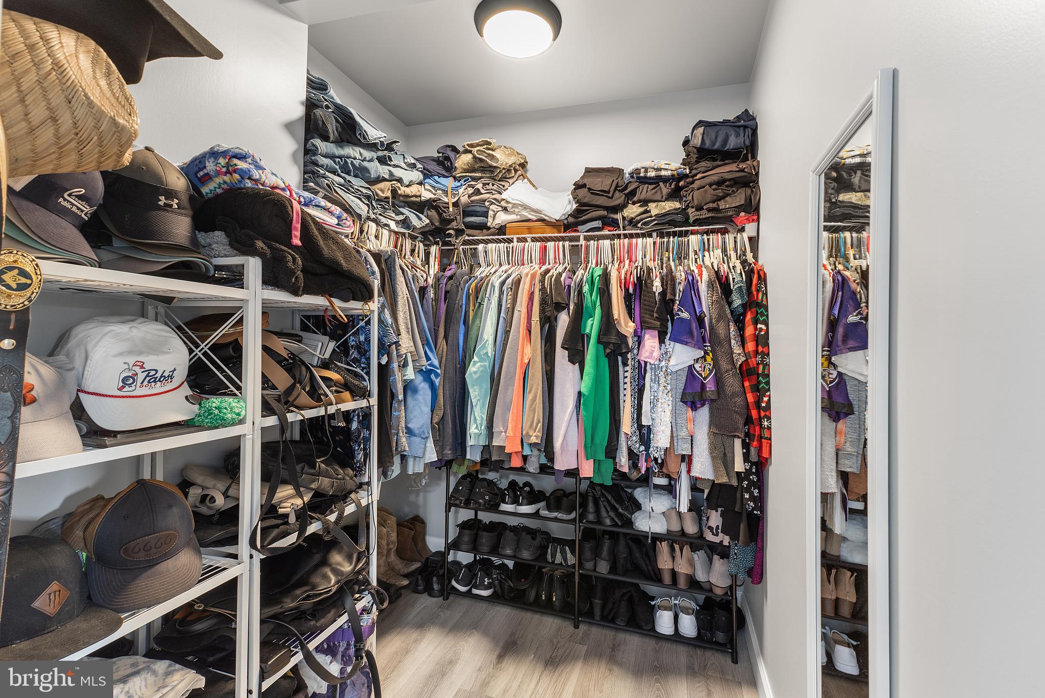 25485 Hignutt Road Denton, MD 21629 - Photo 24 of 52 a view of walk in closet with clothes and shoes