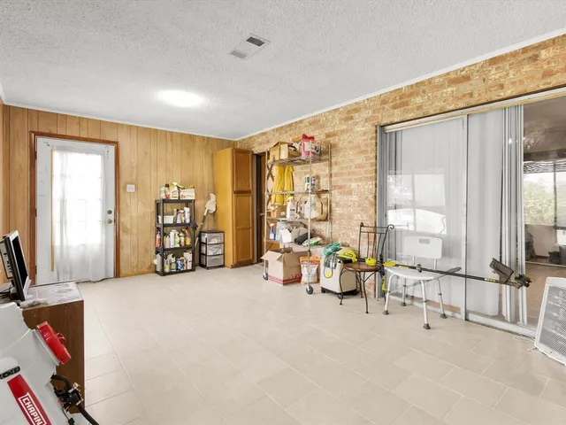 a view of a livingroom with furniture and a flat screen tv