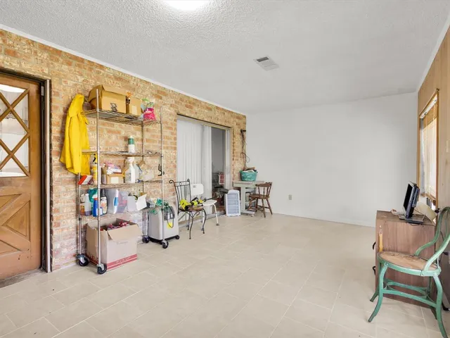 a living room with furniture and natural light