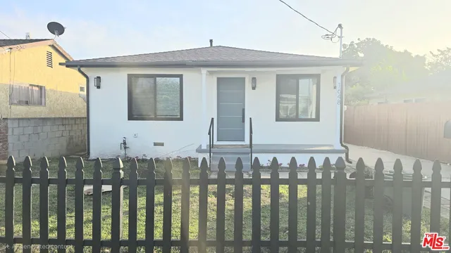 a front view of a house having yard