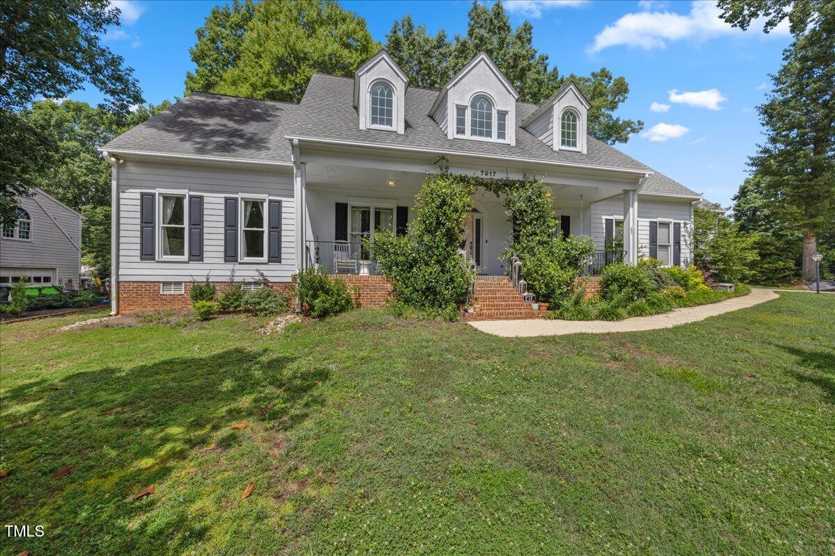 7917 Rooksley Court Raleigh, NC 27615 - Photo 1 of 45 a front view of a house with a yard