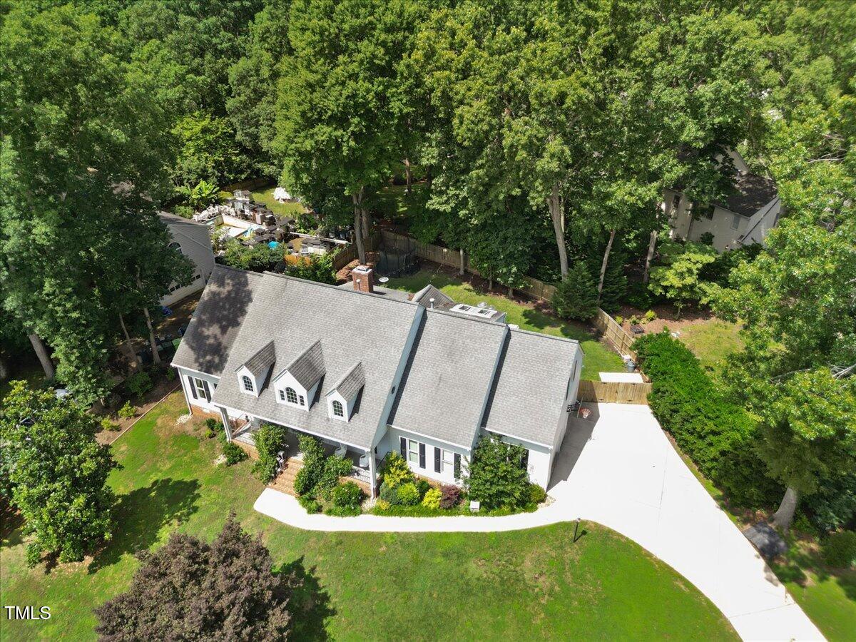 7917 Rooksley Court Raleigh, NC 27615 - Photo 2 of 45 a view of a park with large trees