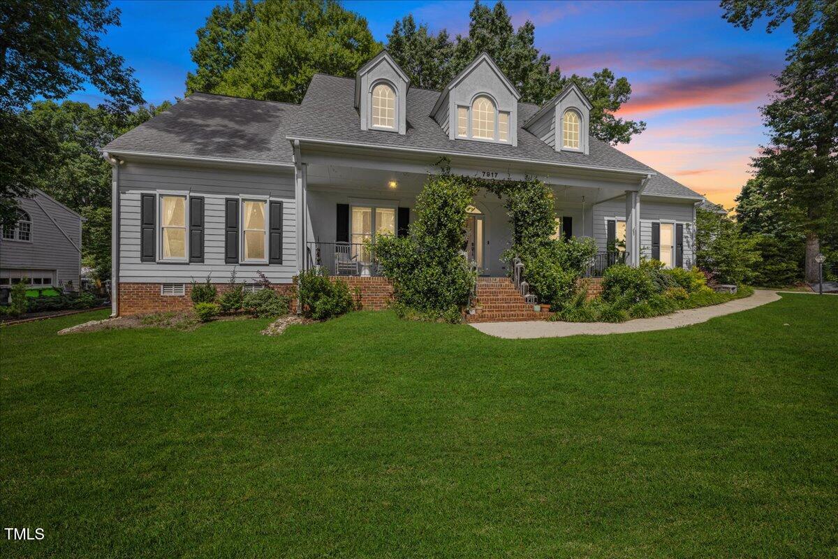 7917 Rooksley Court Raleigh, NC 27615 - Photo 41 of 45 a front view of a house with a garden