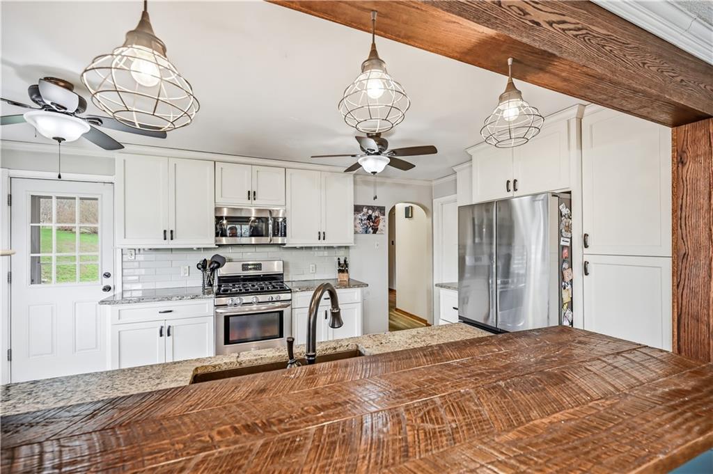 516 Wallace Run Road Darlington, PA 16115 - Photo 17 of 41 View into Kitchen From Wooden Bar