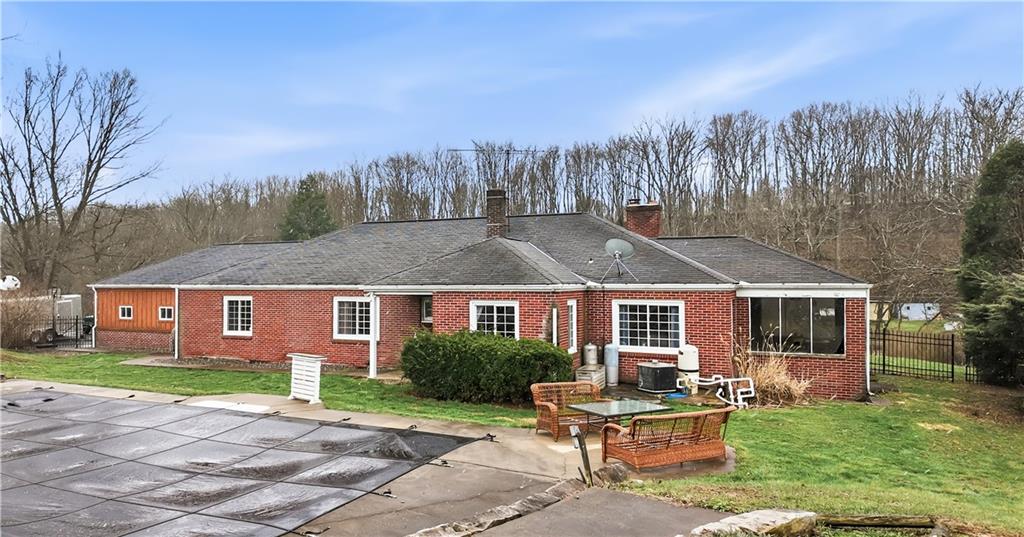 516 Wallace Run Road Darlington, PA 16115 - Photo 5 of 41 Back of house showing screened in porch and pool