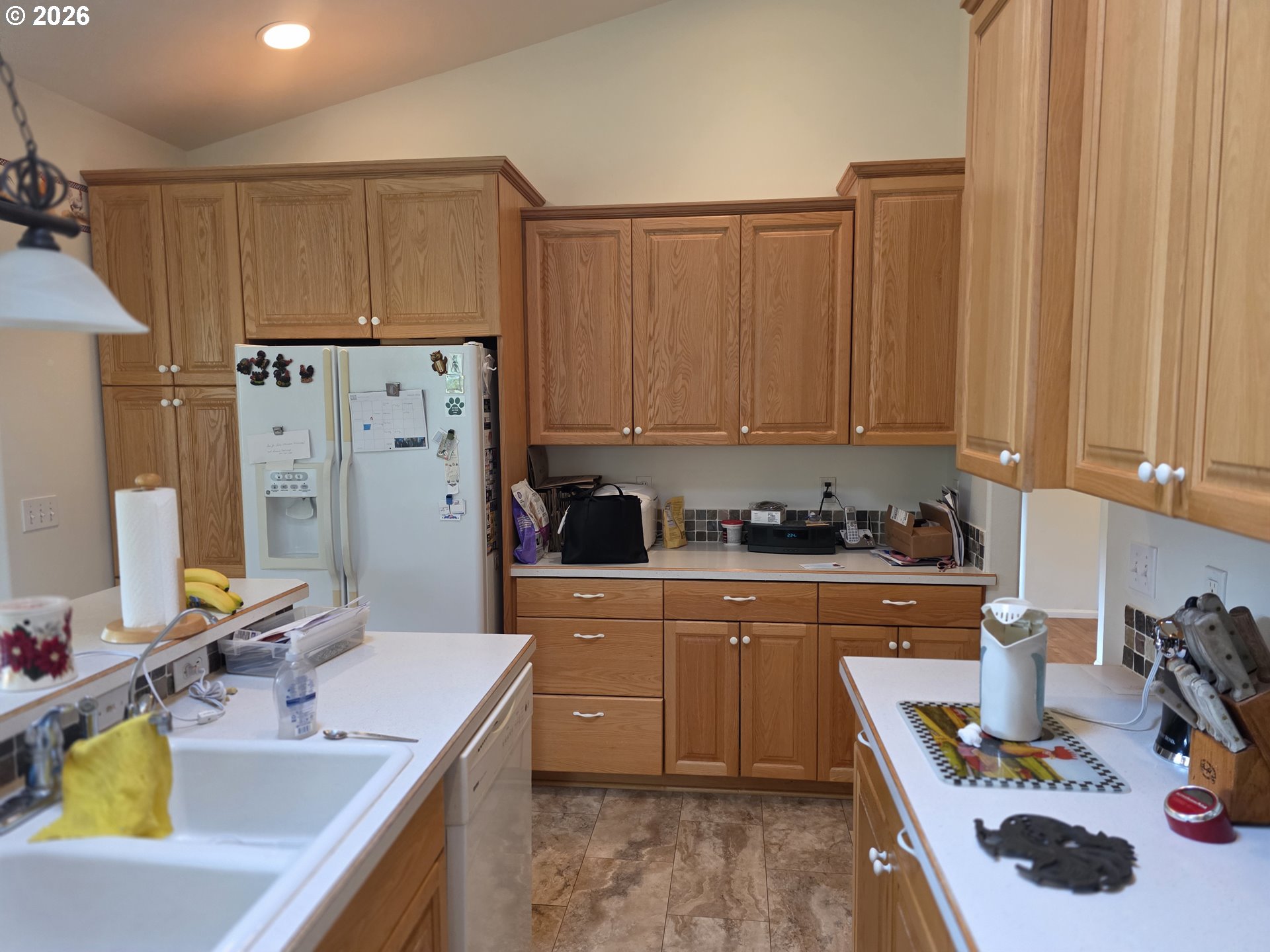 1909 Southwest Duke Road Sutherlin, OR 97479 - Photo 13 of 30 a kitchen with refrigerator and cabinets