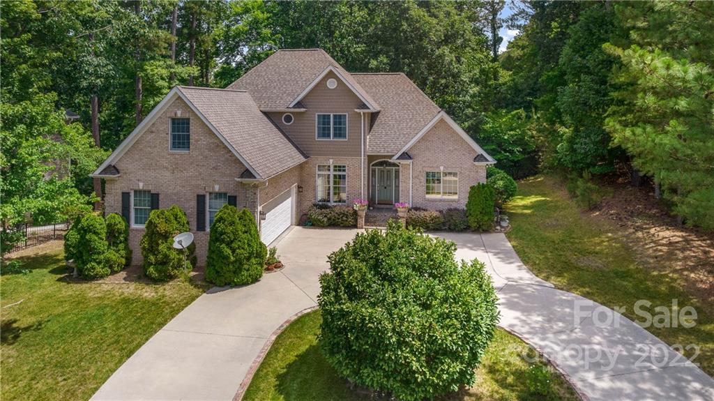11147 Scullers Run Tega Cay, SC 29708 - Photo 1 of 39 a front view of a house with garden