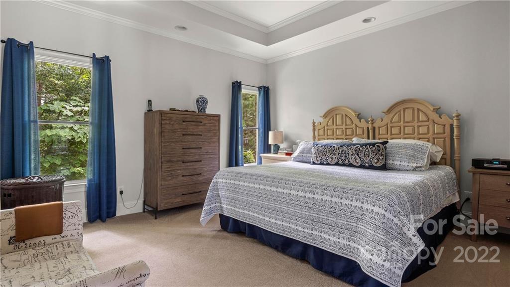 11147 Scullers Run Tega Cay, SC 29708 - Photo 13 of 39 a bedroom with a bed and a dresser