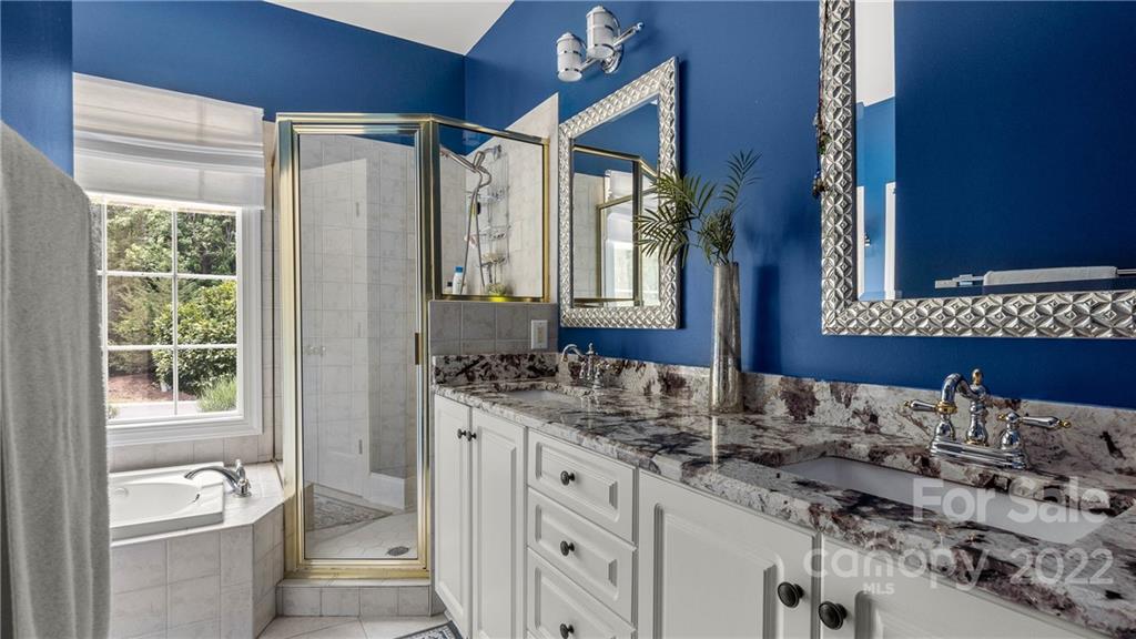 11147 Scullers Run Tega Cay, SC 29708 - Photo 15 of 39 a bathroom with a granite countertop sink and a mirror