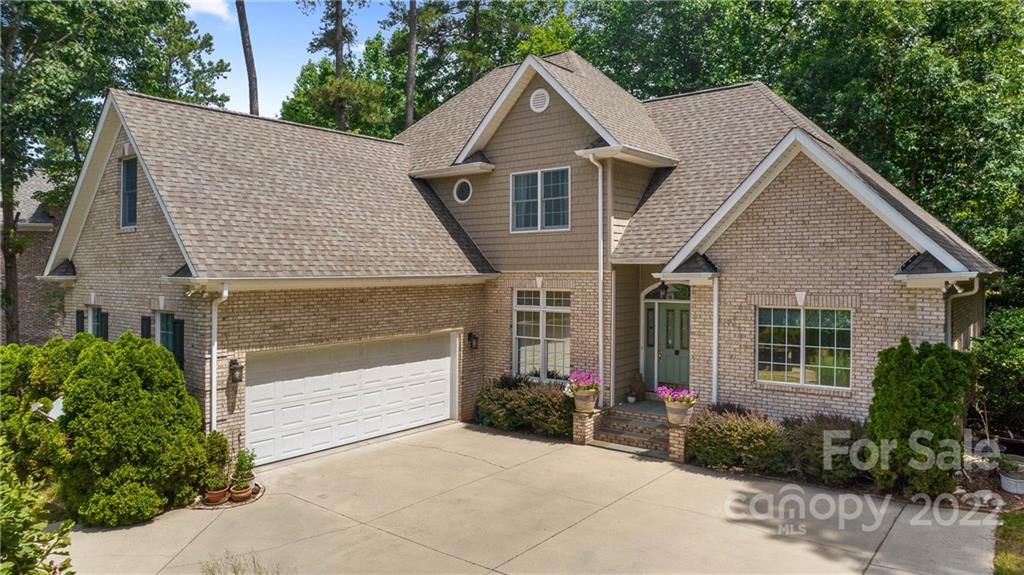 11147 Scullers Run Tega Cay, SC 29708 - Photo 2 of 39 a front view of a house with garden