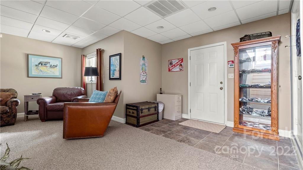 11147 Scullers Run Tega Cay, SC 29708 - Photo 25 of 39 a living room with furniture a window and a ceiling fan