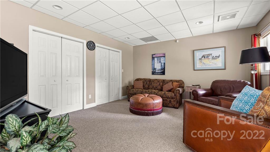 11147 Scullers Run Tega Cay, SC 29708 - Photo 26 of 39 a living room with furniture and a flat screen tv