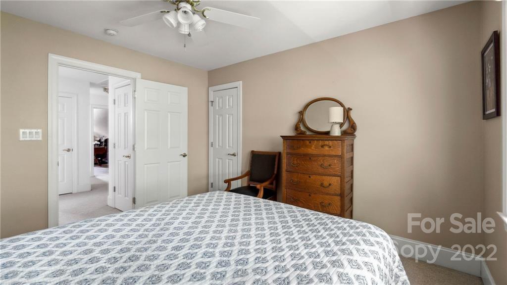 11147 Scullers Run Tega Cay, SC 29708 - Photo 33 of 39 a bedroom with a bed and a dresser