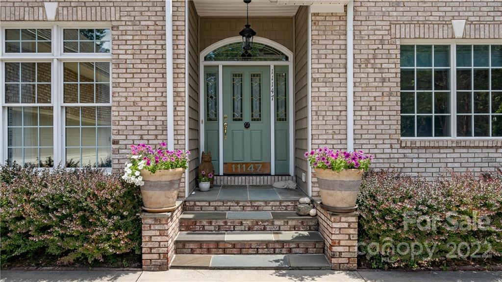 11147 Scullers Run Tega Cay, SC 29708 - Photo 4 of 39 a front view of a house with a porch