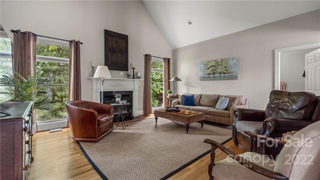 11147 Scullers Run Tega Cay, SC 29708 - Photo 10 of 39 a living room with furniture fireplace and a large window