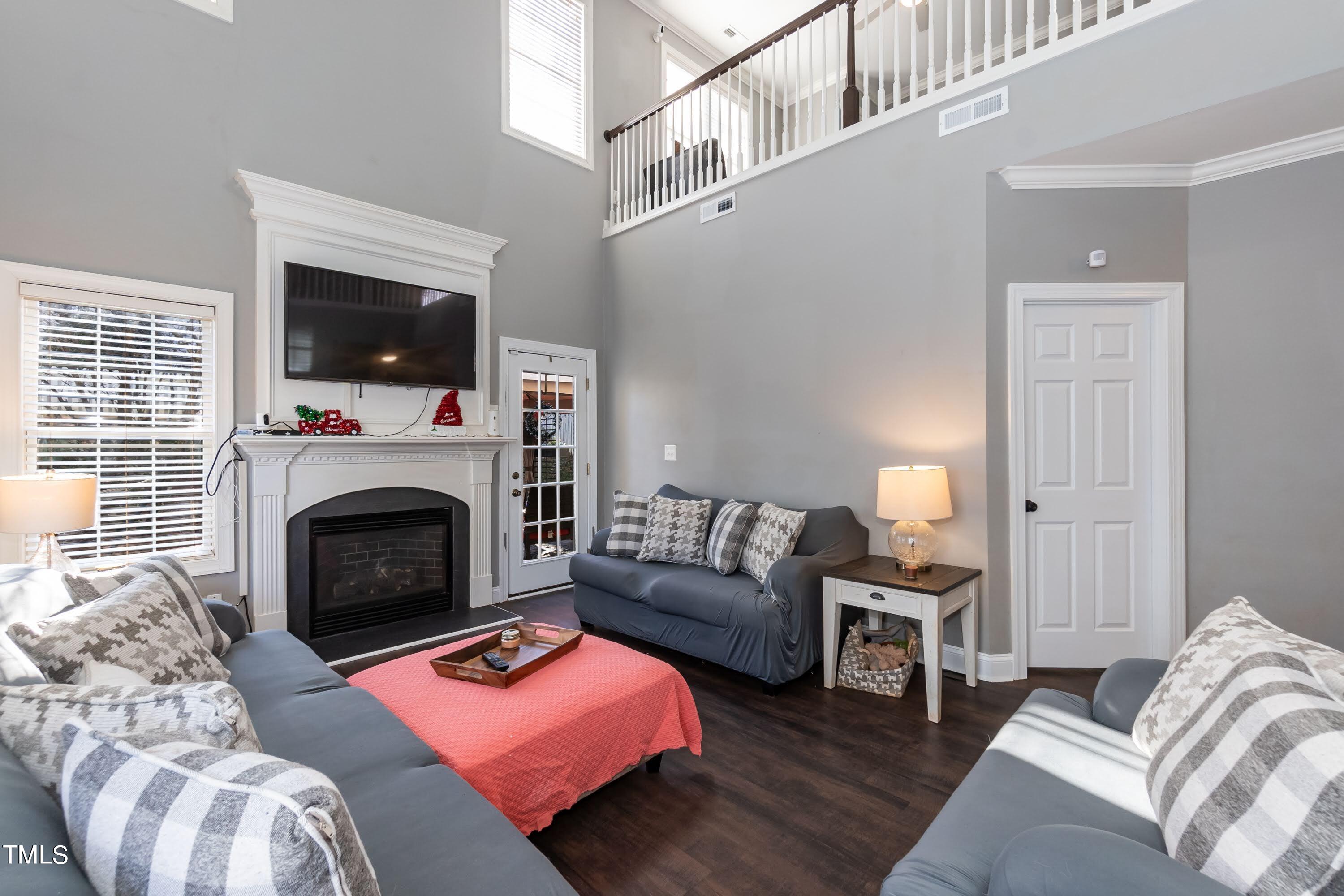 5001 Morning Edge Drive Raleigh, NC 27613 - Photo 13 of 25 a living room with furniture and a fireplace