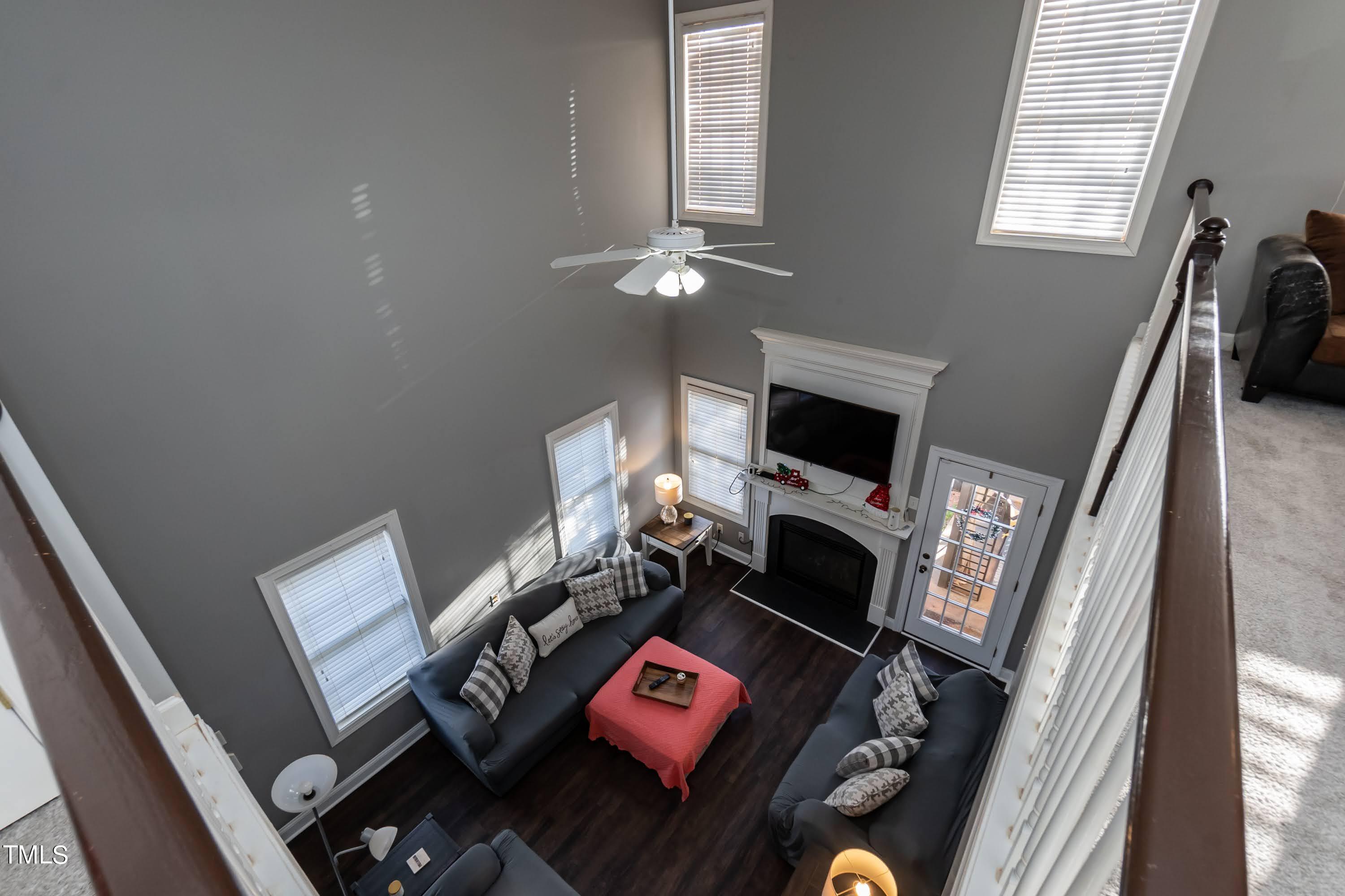 5001 Morning Edge Drive Raleigh, NC 27613 - Photo 15 of 25 a living room with furniture and a fireplace
