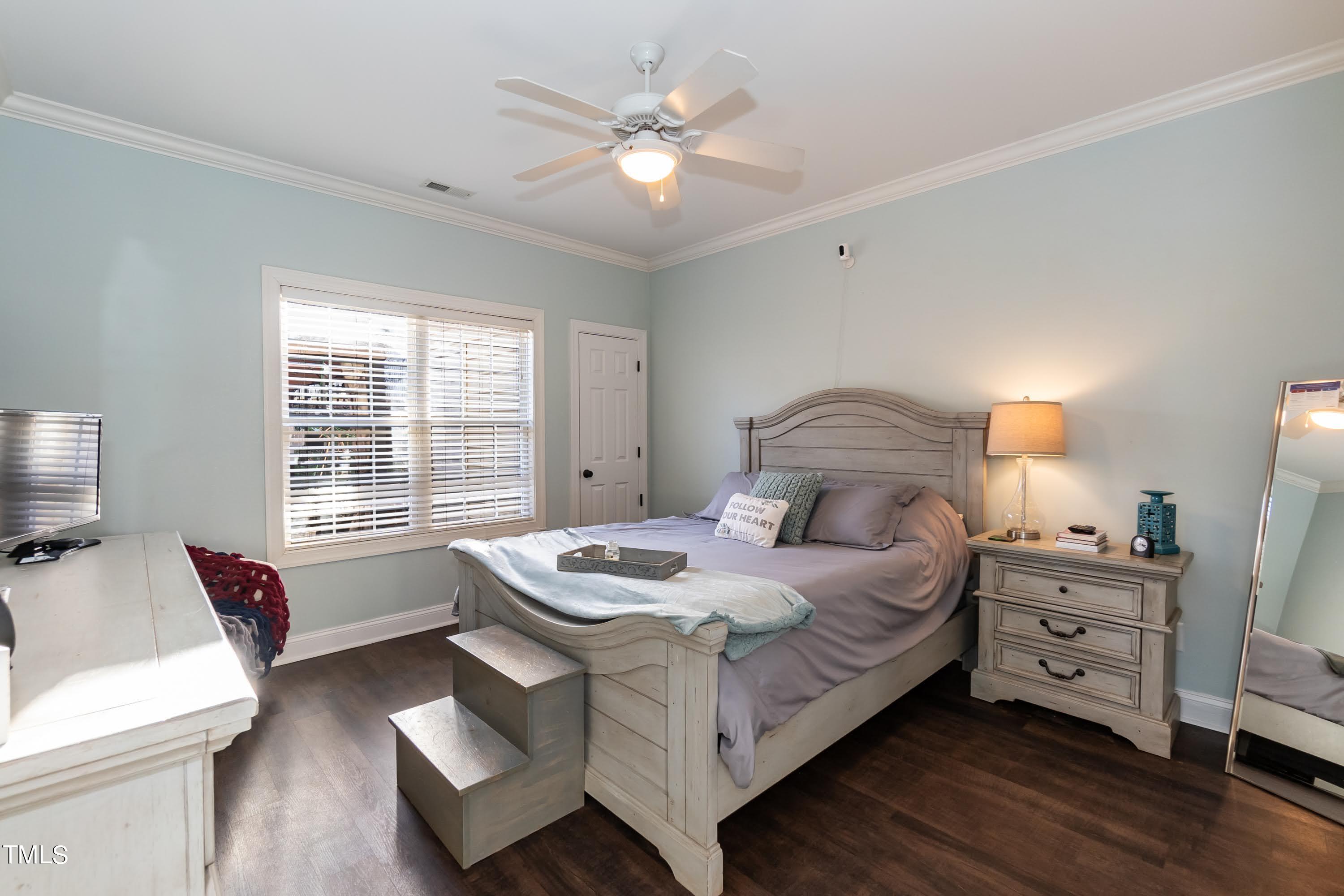 5001 Morning Edge Drive Raleigh, NC 27613 - Photo 16 of 25 a bedroom with a bed and a couch