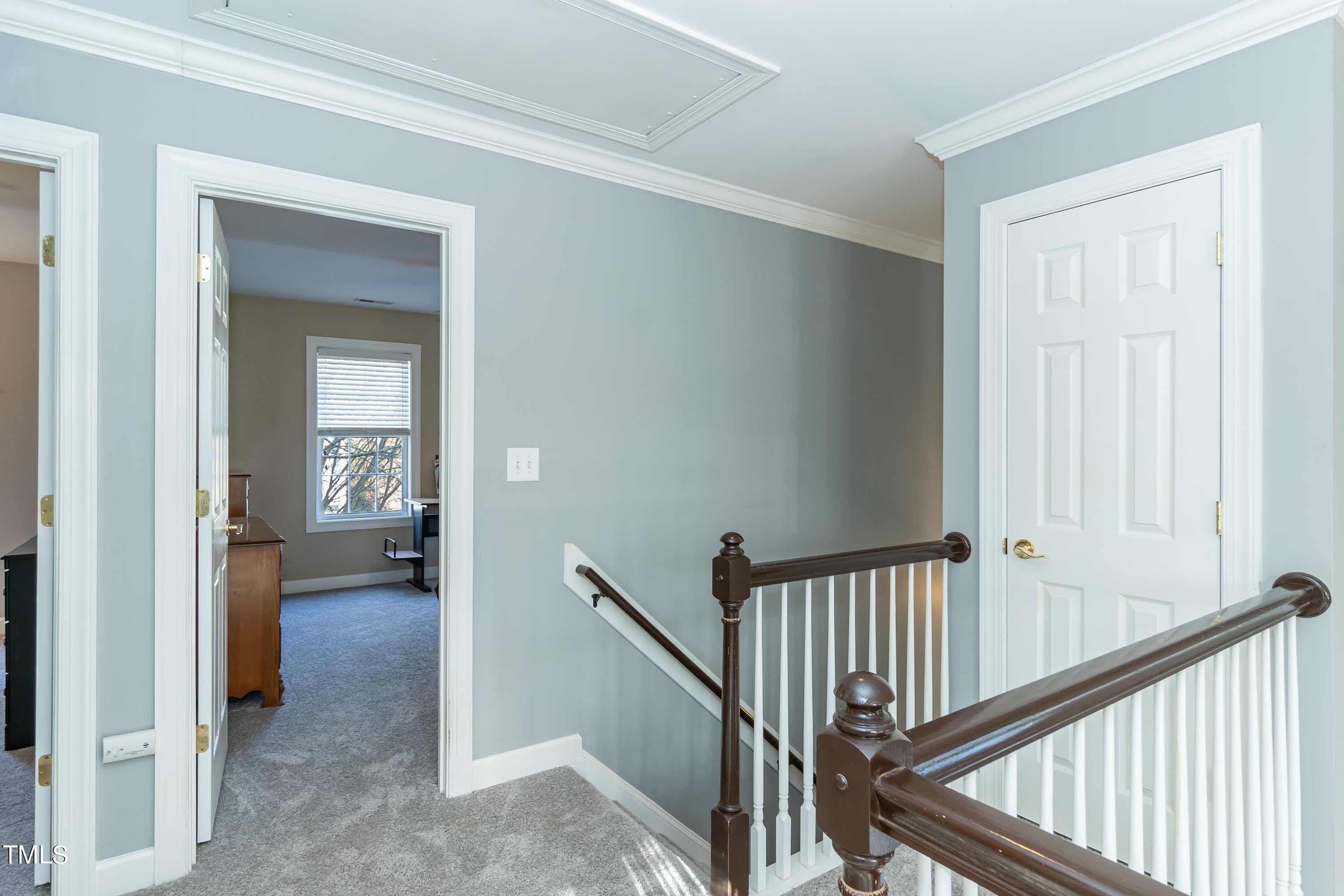 5001 Morning Edge Drive Raleigh, NC 27613 - Photo 19 of 25 a view of a hallway view with staircase