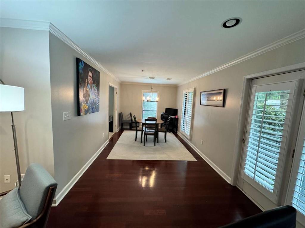 3201 Lenox Road Northeast, Unit 2 Atlanta, GA 30324 - Photo 6 of 39 a view of dining room with wooden floor and a floor to ceiling window