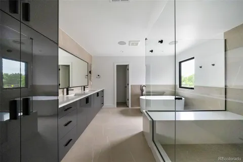 a bathroom with a tub and a shower
