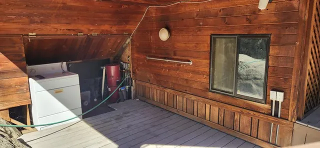 a view of a balcony with wooden floor