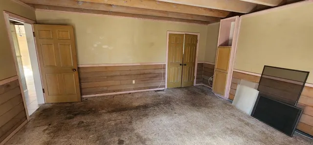 a bathroom with a sink mirror vanity and toilet