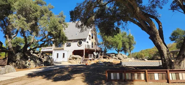 a view of multiple houses with yard