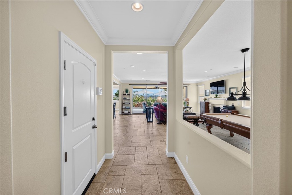 31749 Country View Road Temecula, CA 92591 - Photo 6 of 68 a kitchen with stainless steel appliances a large counter top space and living room view