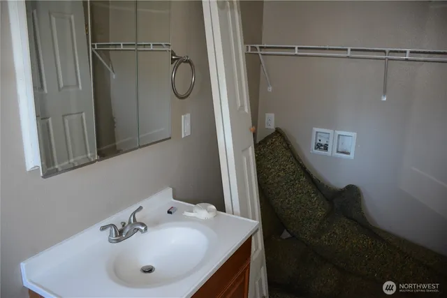 a bathroom with a sink and mirror