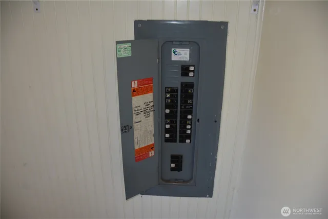 a view of a swimming pool with a yard from a balcony