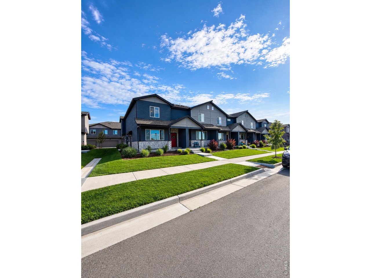 6939 4th St Road, Unit 1 Greeley, CO 80634 - Photo 28 of 30 a view of a house with a big yard plants and large trees